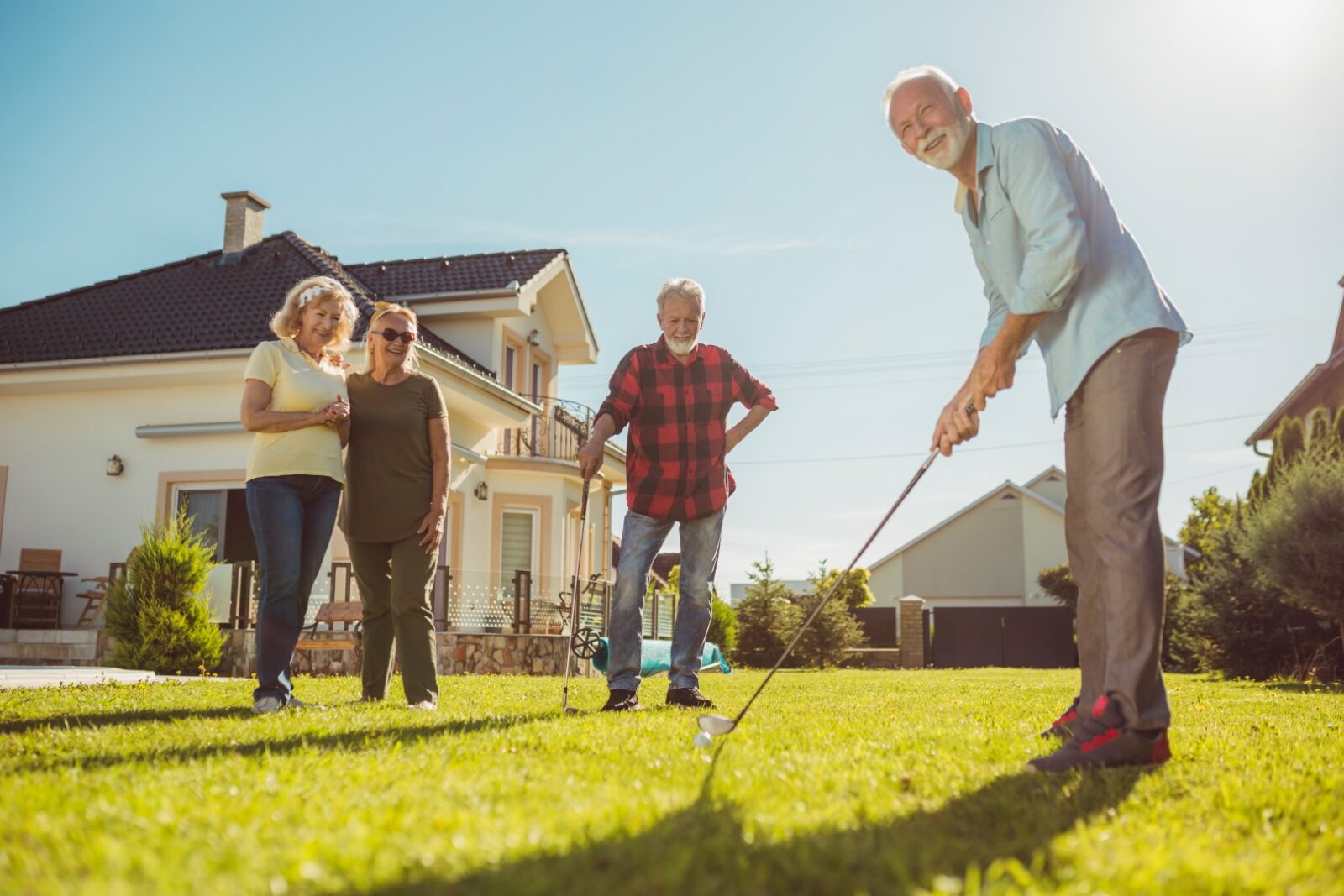 Senior Neighbors Having Fun Playing Mini Golf In T 2023 05 12 22 58 43 Utc