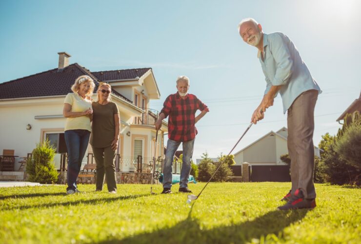 Senior Neighbors Having Fun Playing Mini Golf In T 2023 05 12 22 58 43 Utc