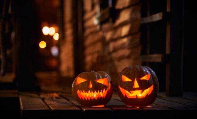 Two Glowing Halloween Pumpkins At The Entrance To 2022 12 16 14 57 45 Utc