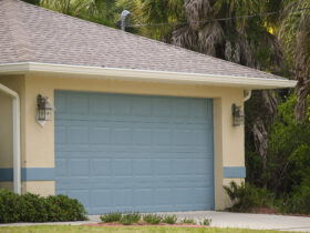 Wide garage double door and concrete driveway of new modern american house