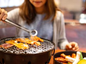 Young Asian Eating Korean Barbecue Yakiniku In Res 2021 10 06 09 53 05 Utc