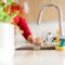 Woman Pouring Tap Water Into Glass In Stylish Kitc 2023 10 31 03 31 39 Utc