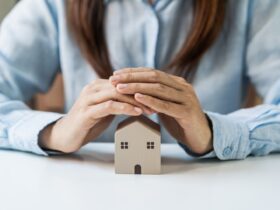 Young Woman Hands Protecting Miniature House Home 2022 01 11 21 49 56 Utc