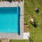 Aerial View Of A Poolside And Grass Turfs Installa 2023 11 27 05 15 42 Utc
