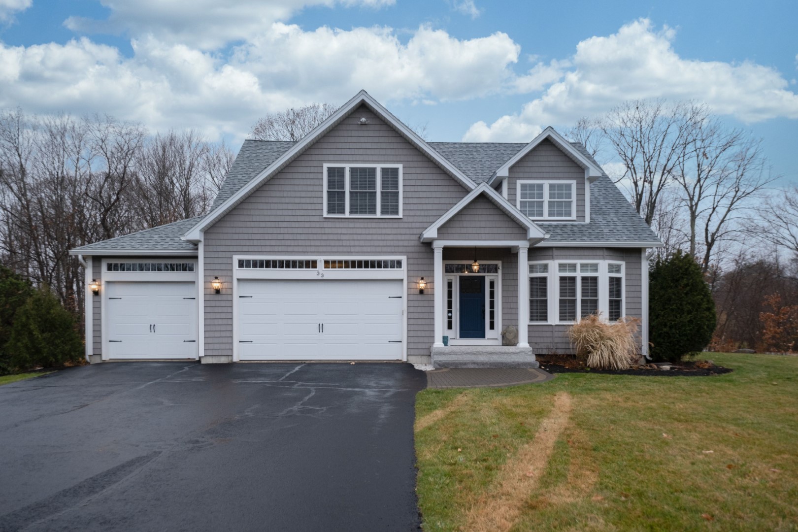 Gray Walled Suburban House With White Asphalt Driv 2023 11 27 05 14 08 Utc