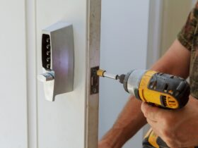Man installing of the door with lock key security