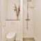 Toilet and shower in bathroom