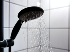 Water from the shower in the modern bathroom