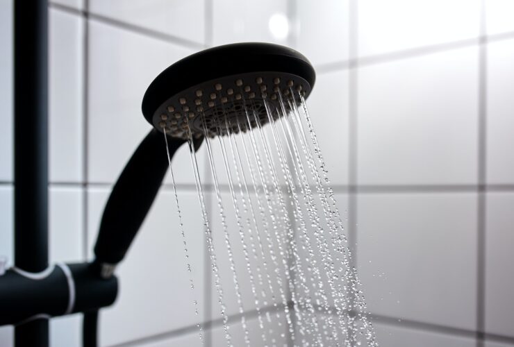 Water from the shower in the modern bathroom