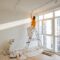Woman with dog renovating house