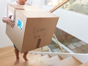 Hispanic Boy Carrying Box Into New Home On Moving 2023 11 27 05 17 28 Utc