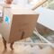 Hispanic Boy Carrying Box Into New Home On Moving 2023 11 27 05 17 28 Utc