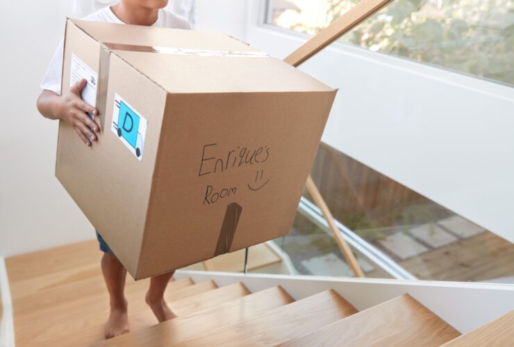 Hispanic Boy Carrying Box Into New Home On Moving 2023 11 27 05 17 28 Utc