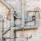 Iron Sewer Pipes On Stone Wall Background 2023 11 27 05 23 58 Utc