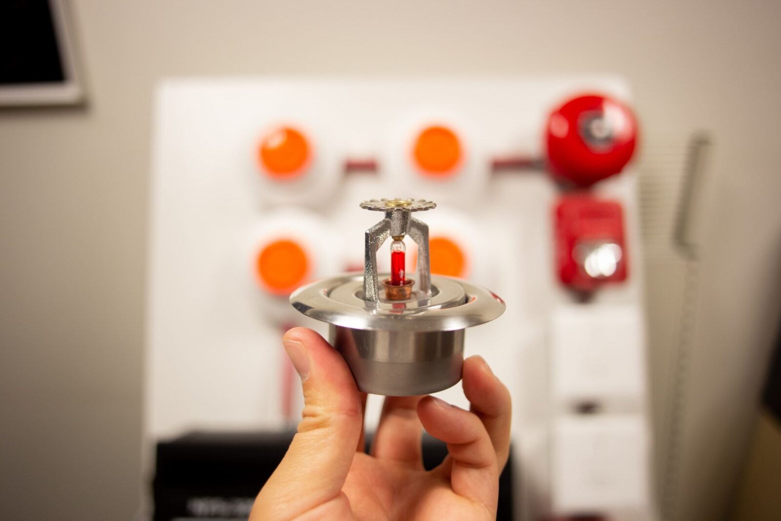 Hand Holding A Silver Fire Alarm System Sensor 2023 11 27 05 25 14 Utc