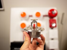 Hand Holding A Silver Fire Alarm System Sensor 2023 11 27 05 25 14 Utc