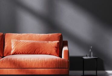 Red Sofa With Black Coffee Table In Empty Room Wit 2023 11 27 04 58 06 Utc