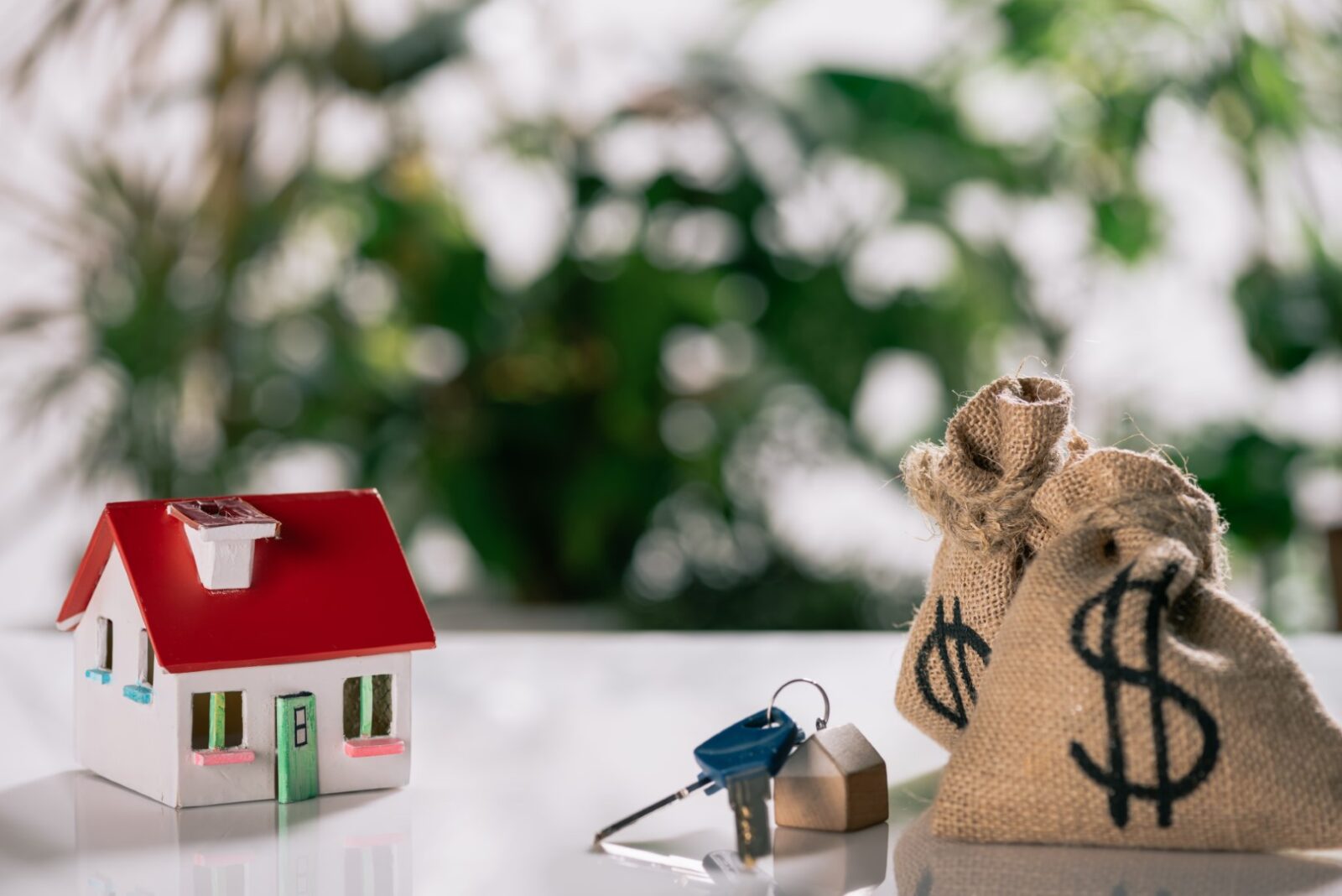 Selective Focus Of Keys House Model And Moneybags 2023 11 27 04 59 47 Utc