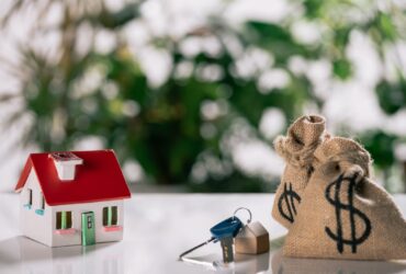 Selective Focus Of Keys House Model And Moneybags 2023 11 27 04 59 47 Utc
