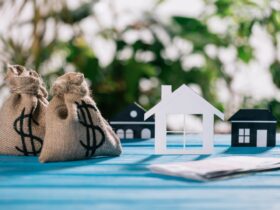 Selective Focus Of Paper Houses And Moneybags With 2023 11 27 05 10 56 Utc