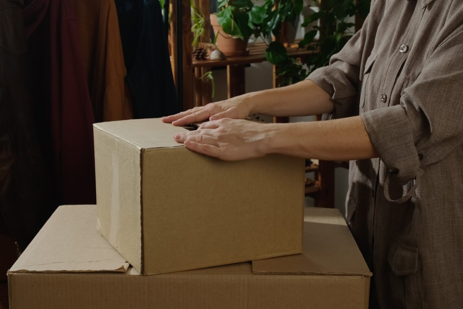 Woman Preparing For Move Packing Goods In Removal 2023 11 27 05 21 20 Utc