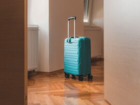 Travel Suitcase Behind The Open Door Of Hotel Apar 2023 11 27 05 19 53 Utc