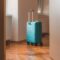 Travel Suitcase Behind The Open Door Of Hotel Apar 2023 11 27 05 19 53 Utc