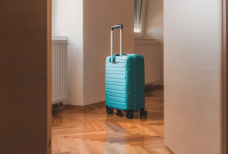 Travel Suitcase Behind The Open Door Of Hotel Apar 2023 11 27 05 19 53 Utc