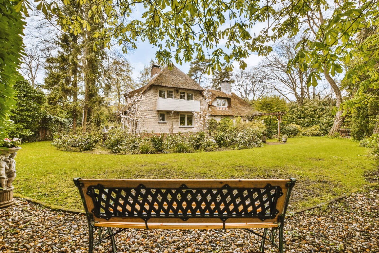 A Bench In A Garden In Front Of A House 2023 11 27 04 53 21 Utc