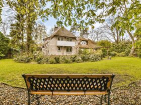 A Bench In A Garden In Front Of A House 2023 11 27 04 53 21 Utc