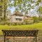 A Bench In A Garden In Front Of A House 2023 11 27 04 53 21 Utc