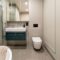 Modern Bright Bathroom With Beige Wall Washbasin 2023 11 27 04 52 49 Utc