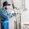 Workman Installing Water Heating System 2023 11 27 05 31 01 Utc