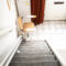 Automatic Stair Lift On Staircase Taking Elderly People And Disabled Persons Up And Down In A House