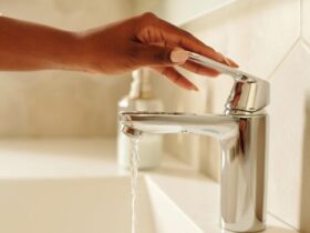 Person Holding a Faucet