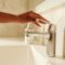 Person Holding a Faucet
