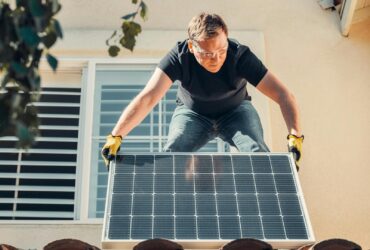 A Man Installing Solar Panel