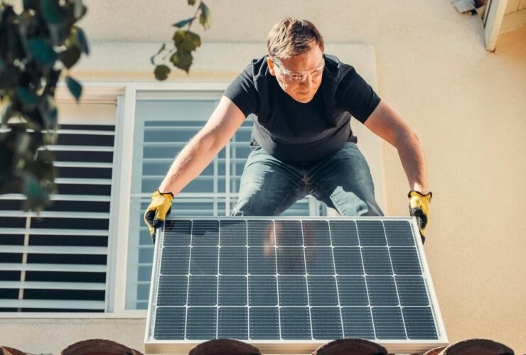 A Man Installing Solar Panel