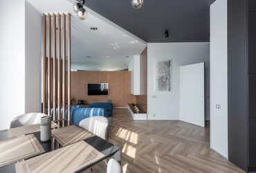 Modern apartment with table near living room