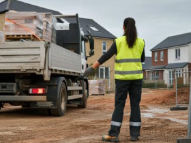 Woman Guides A Reversing Truck On A Residential Building Site