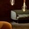 three edison light bulbs beside the sofa