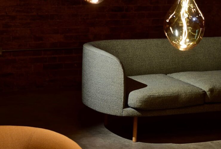 three edison light bulbs beside the sofa