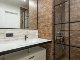 A clean and contemporary bathroom featuring a stylish shower and sleek fixtures.