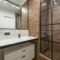 A clean and contemporary bathroom featuring a stylish shower and sleek fixtures.