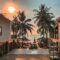 Beautiful sunset over palm-lined beach at Phu Quoc resort, Vietnam, capturing a serene and tropical atmosphere.