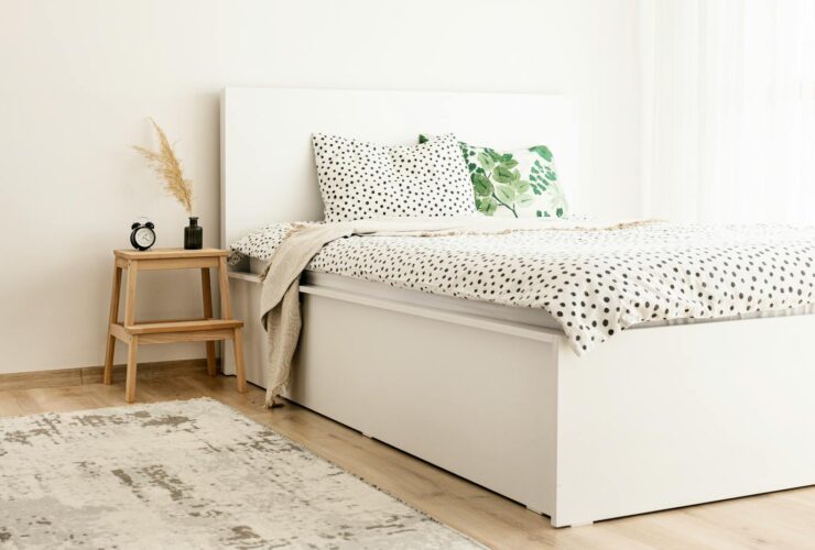 Elegant scandinavian-style bedroom with polka dot bedding and natural decor elements.