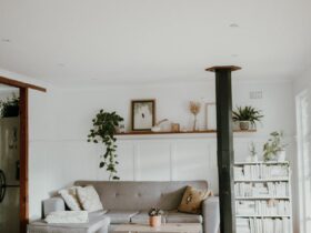Warm and inviting Scandinavian-style living room with neutral decor and indoor plants.