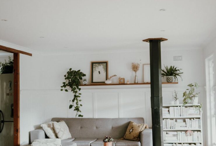 Warm and inviting Scandinavian-style living room with neutral decor and indoor plants.