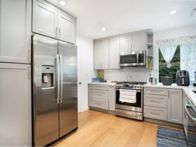 Contemporary kitchen interior featuring stainless steel appliances and sleek cabinetry.