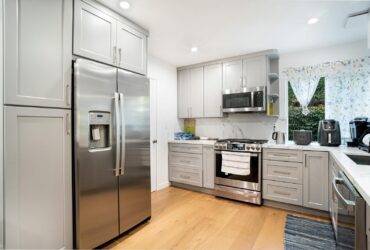 Contemporary kitchen interior featuring stainless steel appliances and sleek cabinetry.